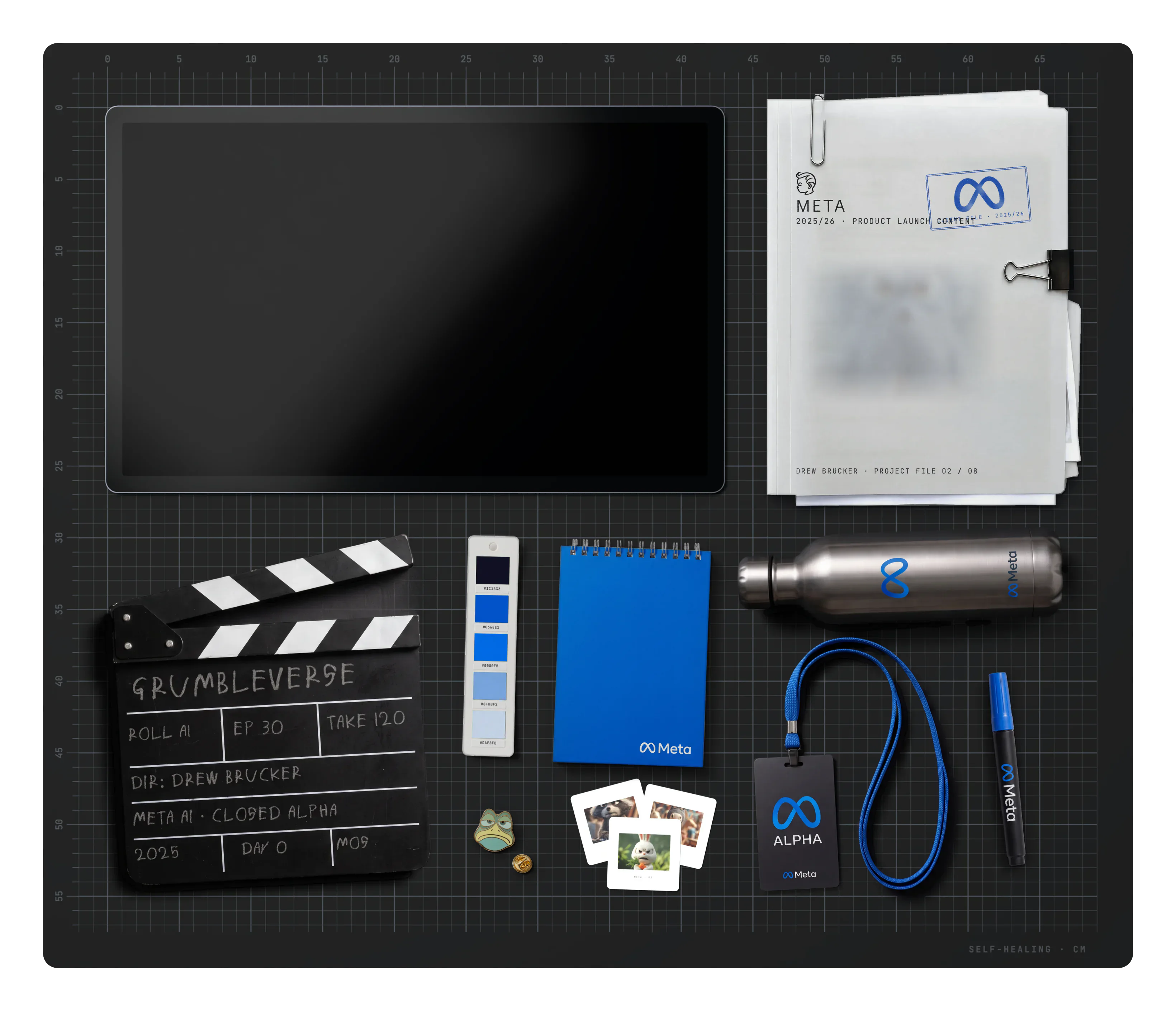 Meta on the desk: the project file, a Grumbleverse clapperboard, the brand swatch, a notebook, a water bottle, slides, an ALPHA lanyard badge, a Meta marker and a Grumbleverse frog pin